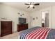 Bedroom with TV and striped bedding at 2303 N General Dr, Florence, AZ 85132