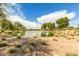 Peaceful community lake with lush landscaping at 2303 N General Dr, Florence, AZ 85132