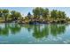 Scenic community lake with playground and waterfall features at 2303 N General Dr, Florence, AZ 85132