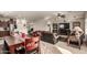 Dining area with wooden table and chairs adjacent to a living room at 2303 N General Dr, Florence, AZ 85132