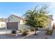 Tan house with brown garage door and desert landscaping at 2303 N General Dr, Florence, AZ 85132