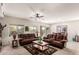 Spacious living room with brown leather couches and a coffee table at 2303 N General Dr, Florence, AZ 85132