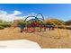 Modern playground structure with climbing features and play areas for children at 2303 N General Dr, Florence, AZ 85132