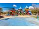 Colorful playground with slides, climbing structures, and shaded areas at 2303 N General Dr, Florence, AZ 85132