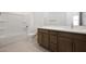 Bathroom features tile floor, vanity, white countertop, and shower at 24216 W Agora Ln Ln, Buckeye, AZ 85326