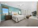 Main bedroom with a plush bed, stylish decor, and an accent wall at 24216 W Agora Ln Ln, Buckeye, AZ 85326