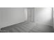 Bright bedroom with gray carpet and white walls at 24216 W Agora Ln Ln, Buckeye, AZ 85326