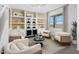 Relaxing wine room with built in shelving and seating area at 24216 W Agora Ln Ln, Buckeye, AZ 85326