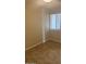 Simple bedroom with tile flooring and a window with blinds at 2447 W Emile Zola Ave, Phoenix, AZ 85029