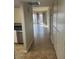 Bright hallway with tile flooring leading to living areas at 2447 W Emile Zola Ave, Phoenix, AZ 85029