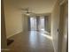 Spacious living room with tile floors and sliding glass doors to patio at 2447 W Emile Zola Ave, Phoenix, AZ 85029