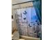 Bathroom with shower/tub, toilet, and floral-themed shower curtain at 2503 E Southgate Ave, Phoenix, AZ 85040