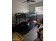 Small bedroom with bunk bed and wood-look flooring at 2503 E Southgate Ave, Phoenix, AZ 85040