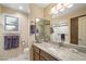 Well-lit bathroom featuring a large mirror, granite countertop, and light-colored walls at 25625 N Abajo Dr, Rio Verde, AZ 85263