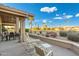 View of covered patio with a ceiling fan, nice furniture, and a wonderful golf course view at 25625 N Abajo Dr, Rio Verde, AZ 85263