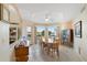 Dining room area with large windows offering natural light and outdoor views; ceiling fan above at 25625 N Abajo Dr, Rio Verde, AZ 85263