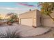 Spacious three-car garage with mature landscaping and ample parking space at 25625 N Abajo Dr, Rio Verde, AZ 85263