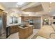 Well-lit kitchen featuring stainless steel appliances, a large island, and warm wood cabinetry at 25625 N Abajo Dr, Rio Verde, AZ 85263