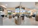 Spacious living room with floor-to-ceiling windows showing mountain views, neutral decor, and fireplace at 25625 N Abajo Dr, Rio Verde, AZ 85263