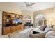 Inviting living room featuring a built-in bookcase and entertainment center, plus plenty of natural light at 25625 N Abajo Dr, Rio Verde, AZ 85263