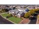 Beautifully landscaped front yard of a modern home, featuring a well-manicured lawn and mature trees at 2668 E Kingbird Ct, Gilbert, AZ 85297