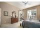 Main bedroom with neutral carpet, furniture and a white bookcase at 3055 N Red Mtn # 156, Mesa, AZ 85207