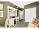 Bedroom with built-in desk, shelving, and closet at 3236 E Chandler Blvd # 2053, Phoenix, AZ 85048