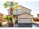 Tan two-story house with a two-car garage and palm trees at 3307 W Leodra Ln, Phoenix, AZ 85041