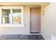 Beige front door with sidelights and a porch at 3307 W Leodra Ln, Phoenix, AZ 85041