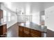 Kitchen with an island and tile flooring at 3307 W Leodra Ln, Phoenix, AZ 85041