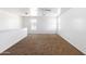 Bright loft with neutral colored walls and carpet at 3307 W Leodra Ln, Phoenix, AZ 85041