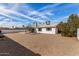 Large backyard with gravel and a covered patio at 3513 W Danbury Dr, Glendale, AZ 85308