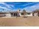 Large backyard with gravel and a covered patio at 3513 W Danbury Dr, Glendale, AZ 85308