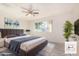 Main bedroom with plush bed and ample natural light at 3513 W Danbury Dr, Glendale, AZ 85308