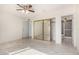 Bedroom with mirrored closet doors and tile floor at 3513 W Danbury Dr, Glendale, AZ 85308