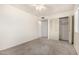 Simple bedroom with double door closet and carpet floor at 3513 W Danbury Dr, Glendale, AZ 85308