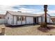 Single-story house with a two-car garage and desert landscaping at 3513 W Danbury Dr, Glendale, AZ 85308