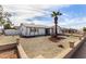 Single-story house with a two-car garage and desert landscaping at 3513 W Danbury Dr, Glendale, AZ 85308