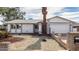 Single-story house with a two-car garage and desert landscaping at 3513 W Danbury Dr, Glendale, AZ 85308