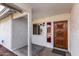 Ornate wooden front door with sidelights and a covered porch at 3513 W Danbury Dr, Glendale, AZ 85308