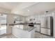 Updated kitchen with granite countertops and white cabinets at 3513 W Danbury Dr, Glendale, AZ 85308