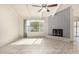 Living room with tile floors, fireplace and large window at 3513 W Danbury Dr, Glendale, AZ 85308