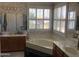 Spacious bathroom with corner tub and double sinks at 3554 E Camino Cir, Mesa, AZ 85213