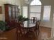 Formal dining room with hardwood floors and a large table at 3554 E Camino Cir, Mesa, AZ 85213