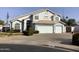 Two-story house with a large driveway and landscaped front yard at 3554 E Camino Cir, Mesa, AZ 85213