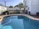 Relaxing pool area with ample space for seating at 3554 E Camino Cir, Mesa, AZ 85213