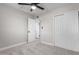 Well-lit bedroom with ceiling fan and ample closet space at 4432 E Belleview St, Phoenix, AZ 85008