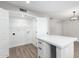 Bright laundry room with shelving and washer/dryer hookups at 4432 E Belleview St, Phoenix, AZ 85008