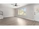 Bright living room featuring hardwood floors and a large window at 4432 E Belleview St, Phoenix, AZ 85008