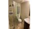 Bathroom featuring a glass enclosed shower and dark wood vanity at 5132 N 31St Way # 112, Phoenix, AZ 85016